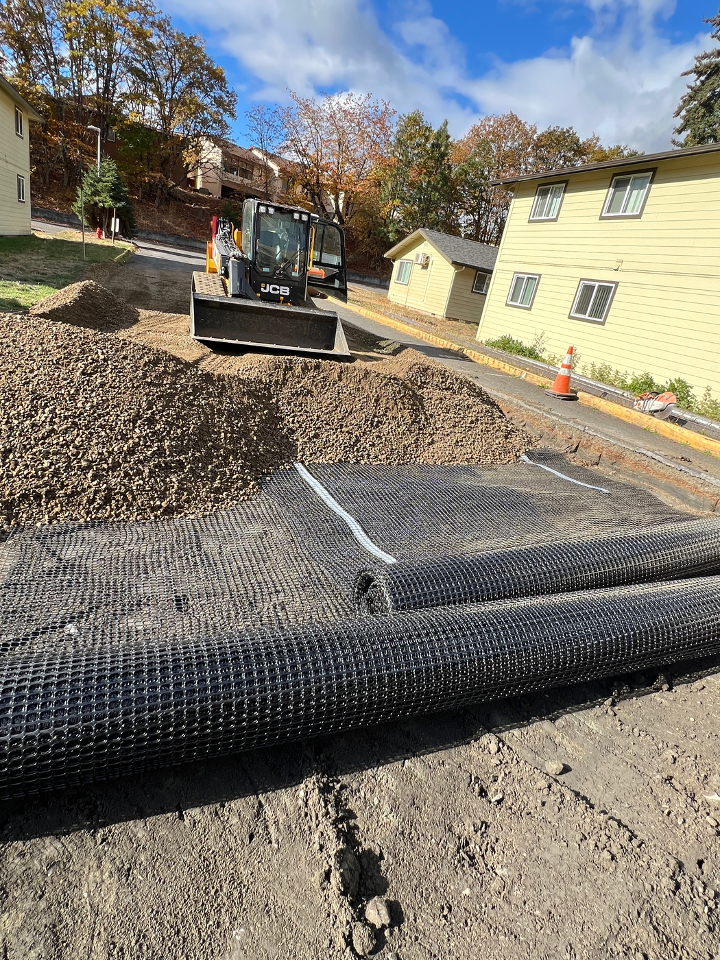 Geogrid subbase preparation for asphalt paving